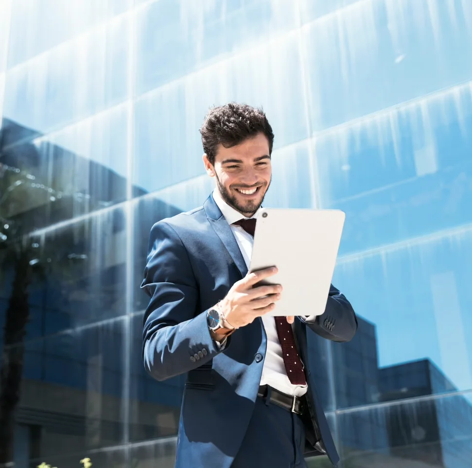 Side view smiley man looking at tablet