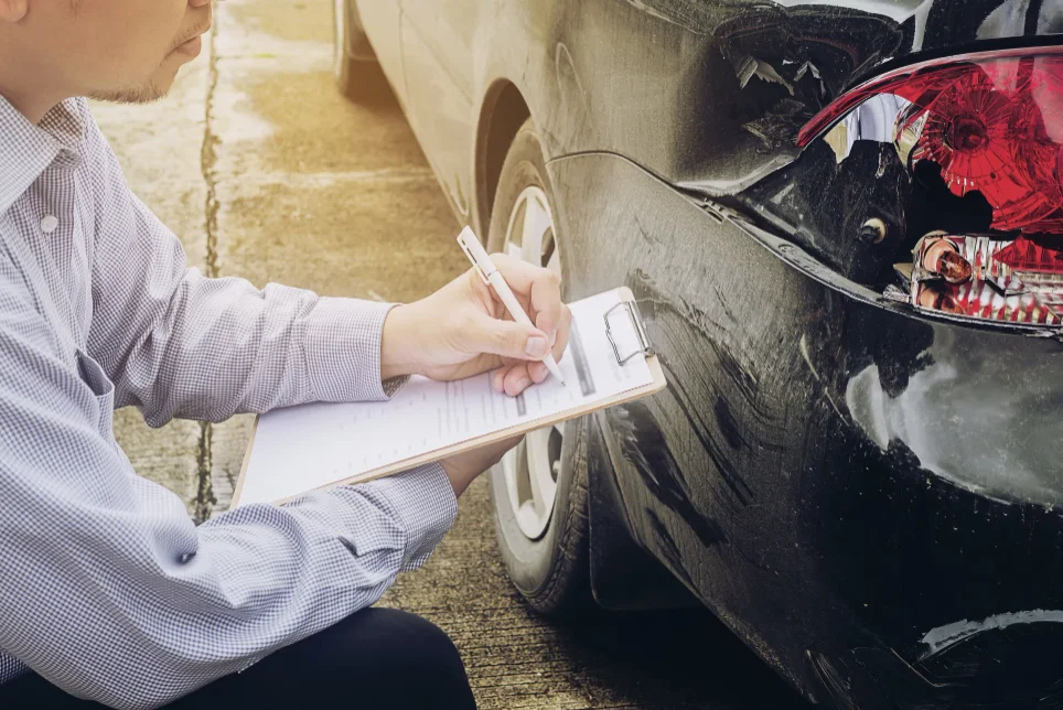 Insurance agent working on car accident claim process